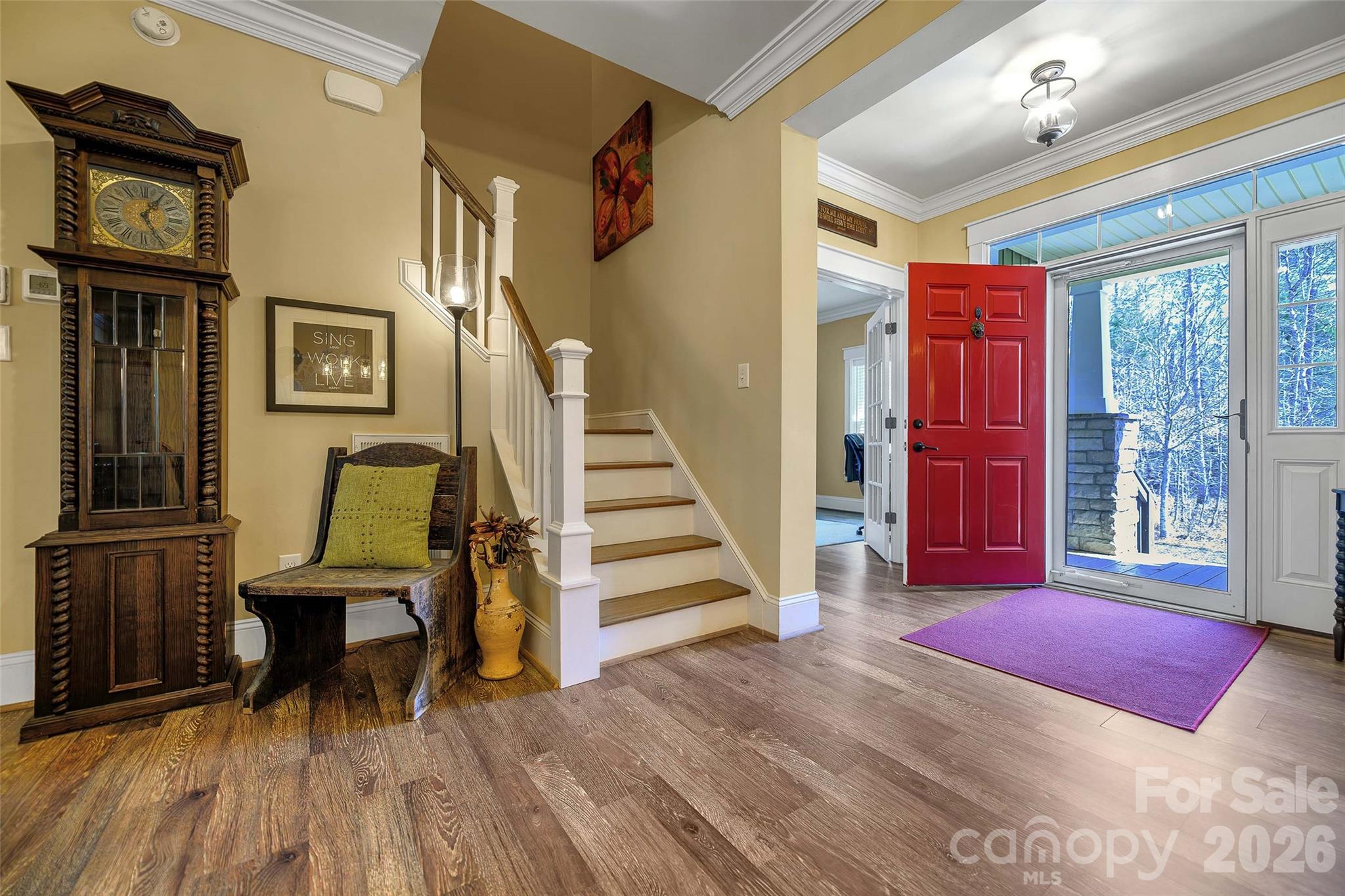 211 Holly Ridge Road Dallas, NC 28034 - Photo 31 of 46 a view of a livingroom with furniture staircase and windows