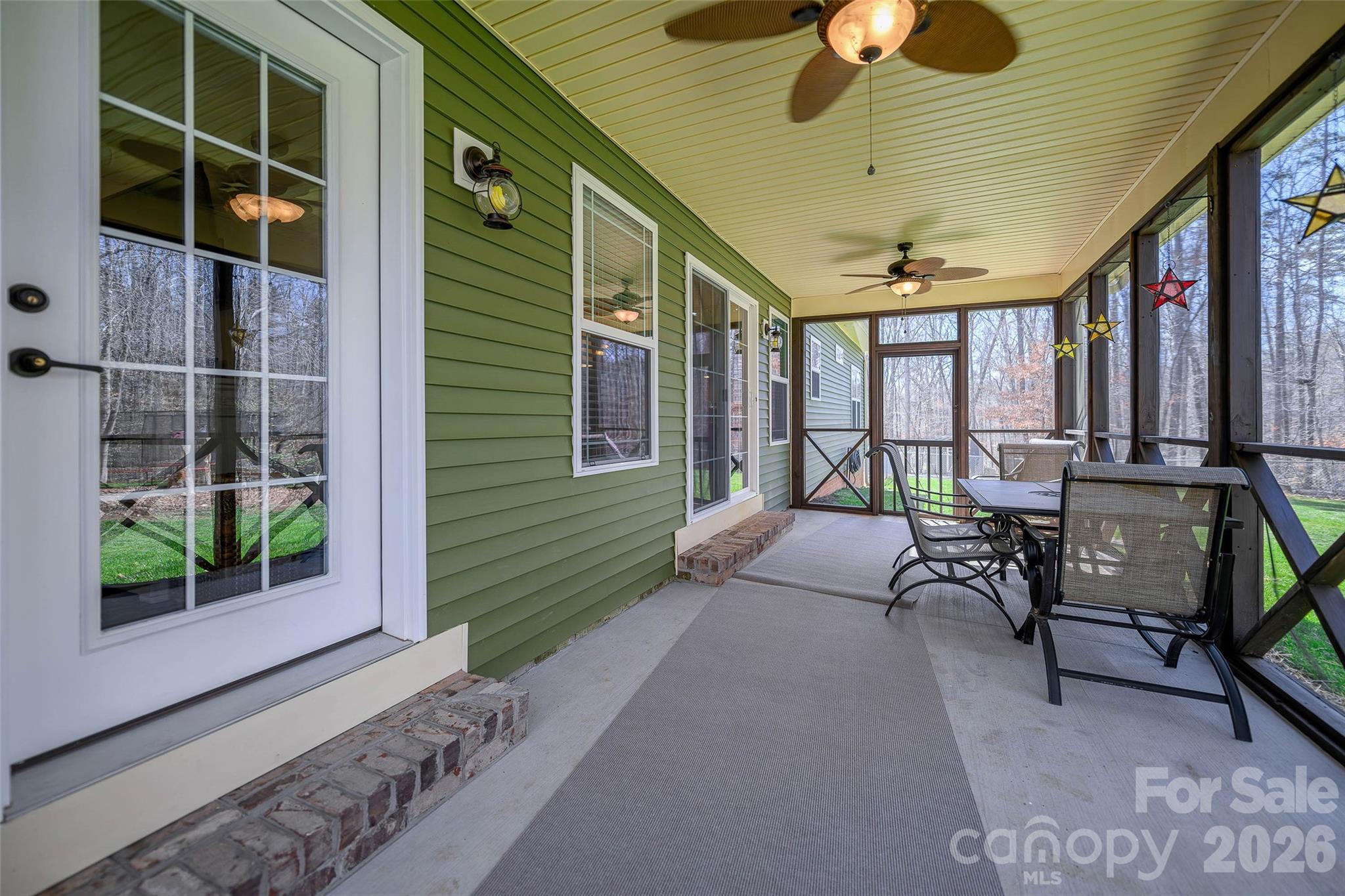 211 Holly Ridge Road Dallas, NC 28034 - Photo 36 of 46 a balcony with furniture and a potted plant