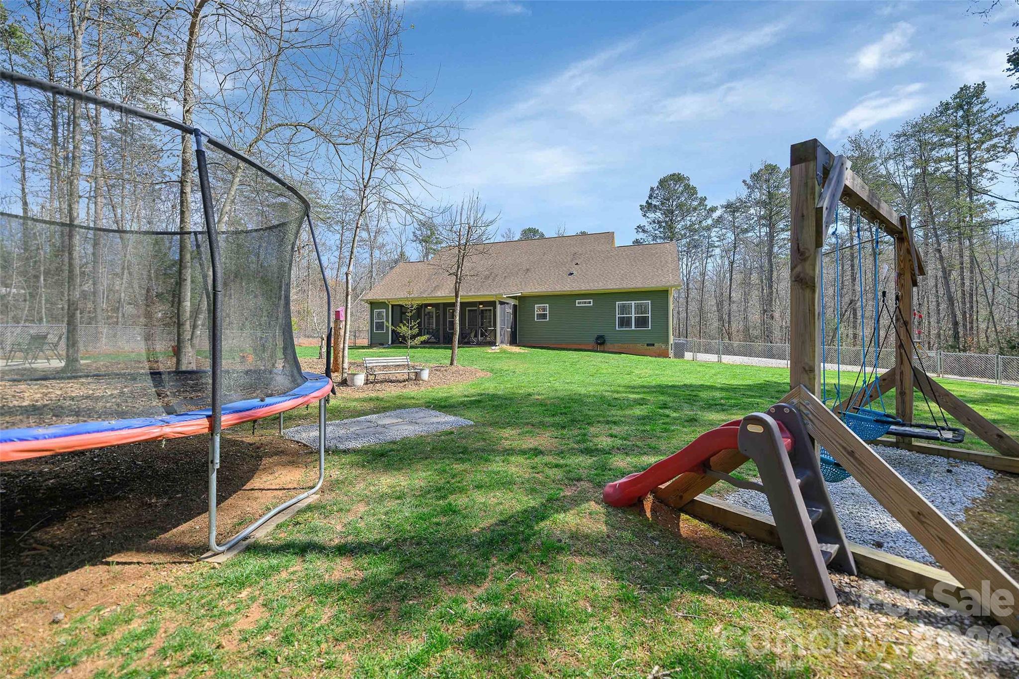 211 Holly Ridge Road Dallas, NC 28034 - Photo 42 of 46 a view of a house with backyard and sitting area