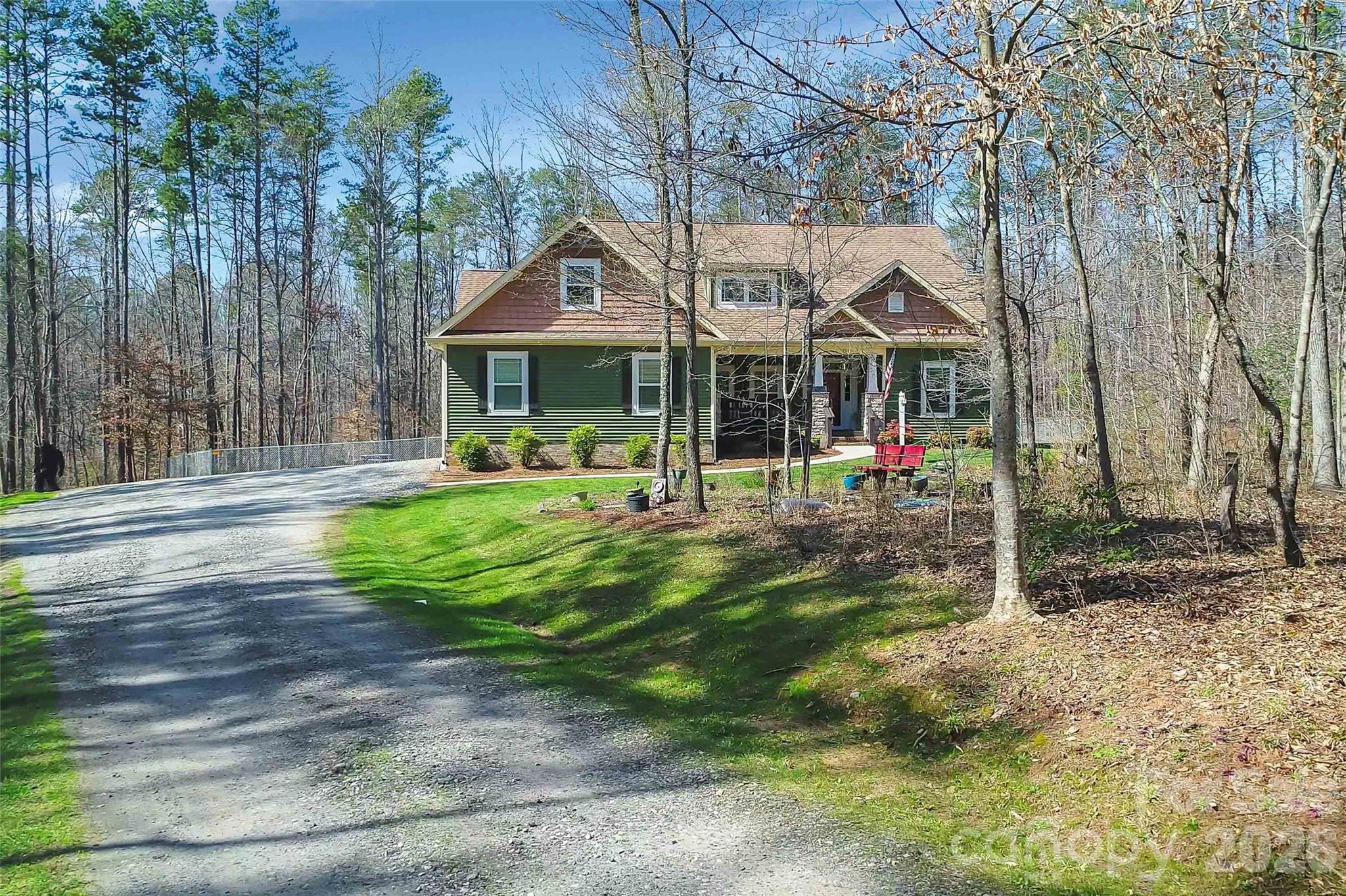 211 Holly Ridge Road Dallas, NC 28034 - Photo 45 of 46 a view of a house with a yard patio and fire pit