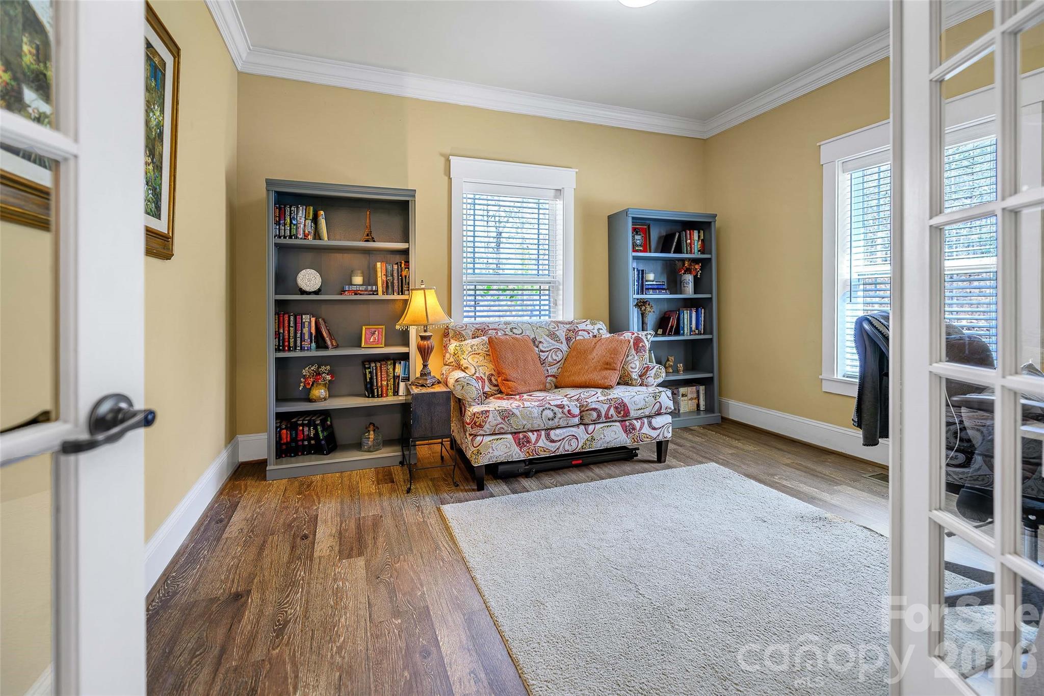 211 Holly Ridge Road Dallas, NC 28034 - Photo 9 of 46 a bedroom with furniture and a book shelf