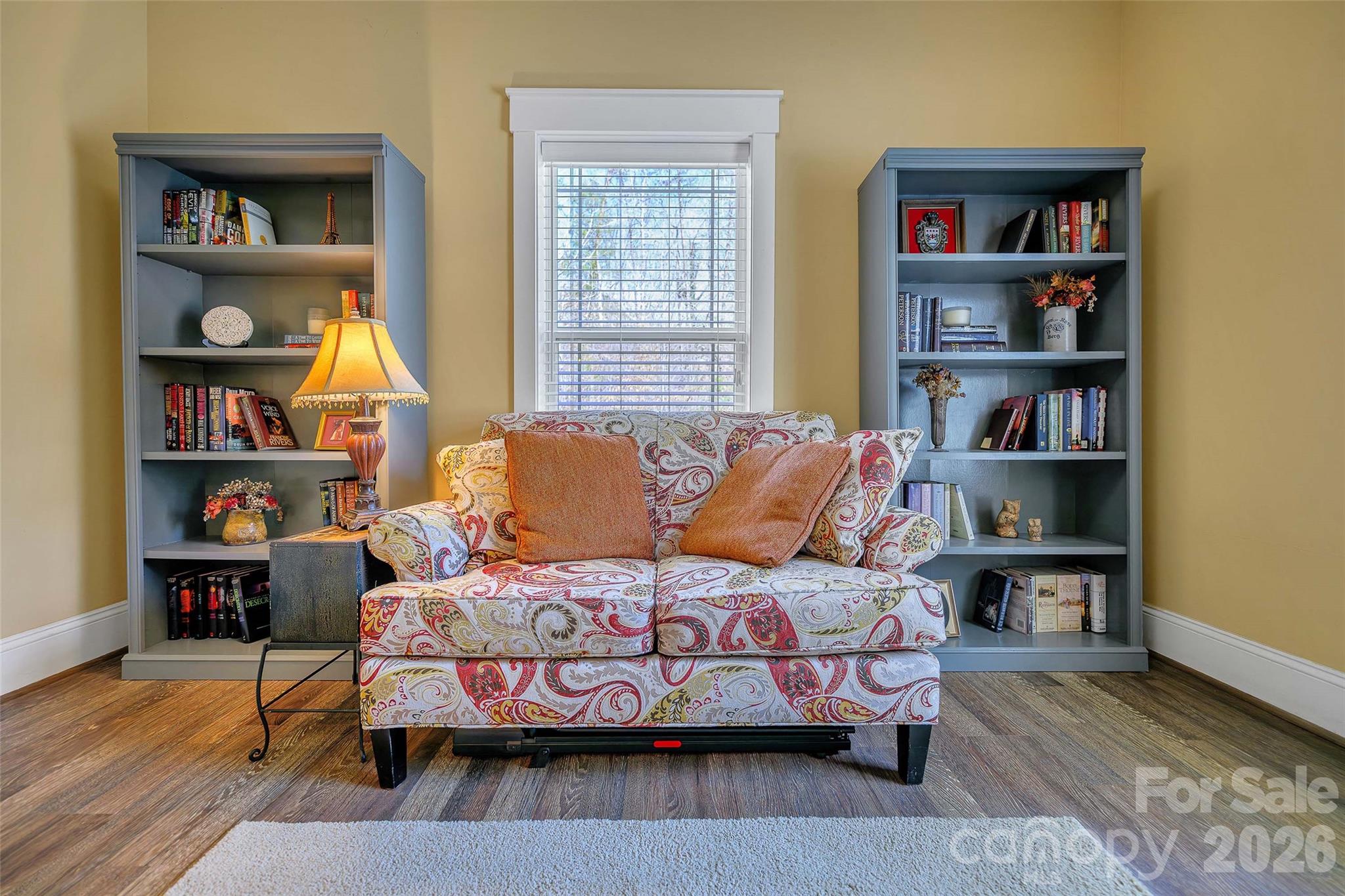 211 Holly Ridge Road Dallas, NC 28034 - Photo 10 of 46 a bedroom with bed and a book shelf