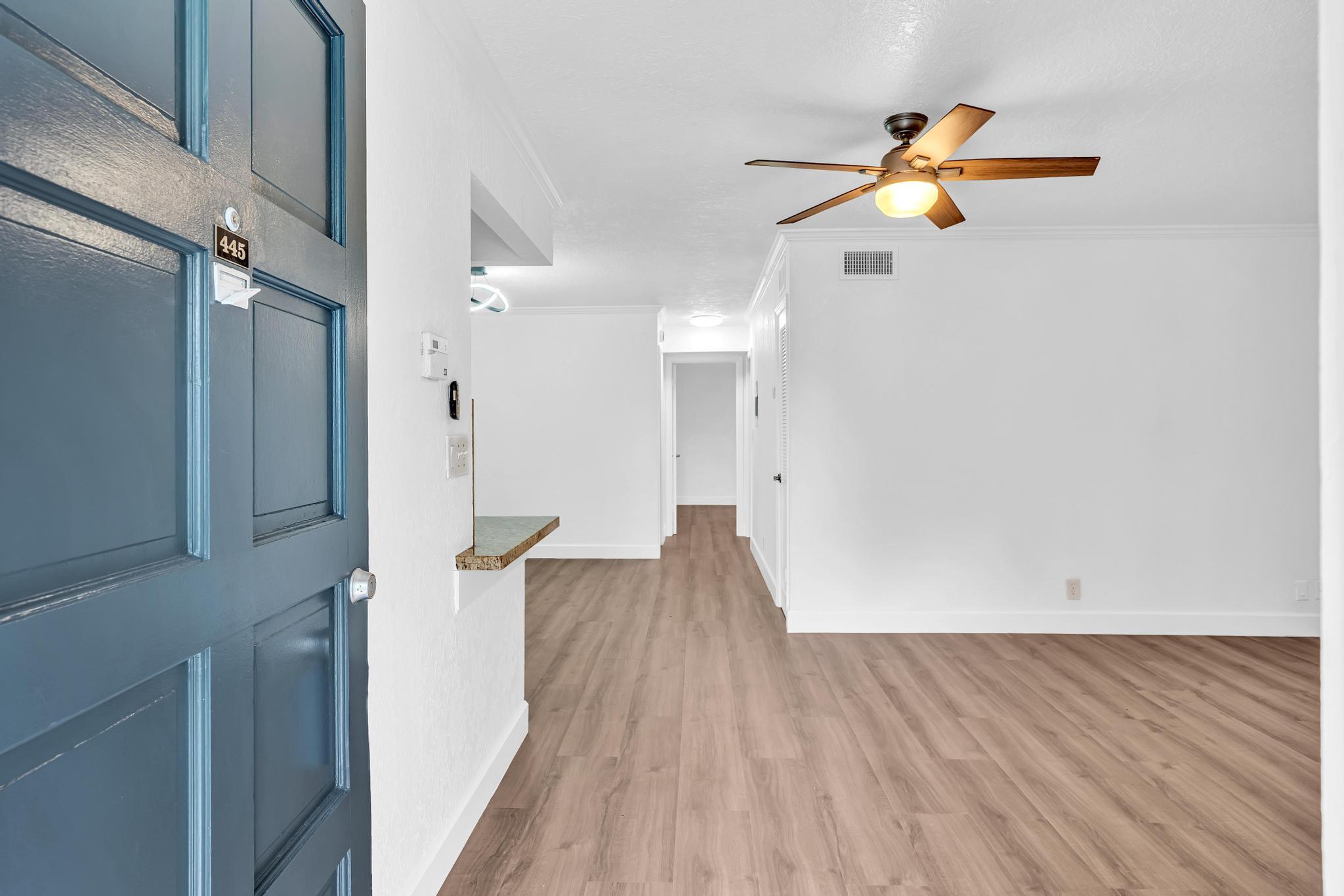 1291 Northwest 13th Street, Unit 445D Boca Raton, FL 33486 - Photo 7 of 50 a view of a livingroom with wooden floor