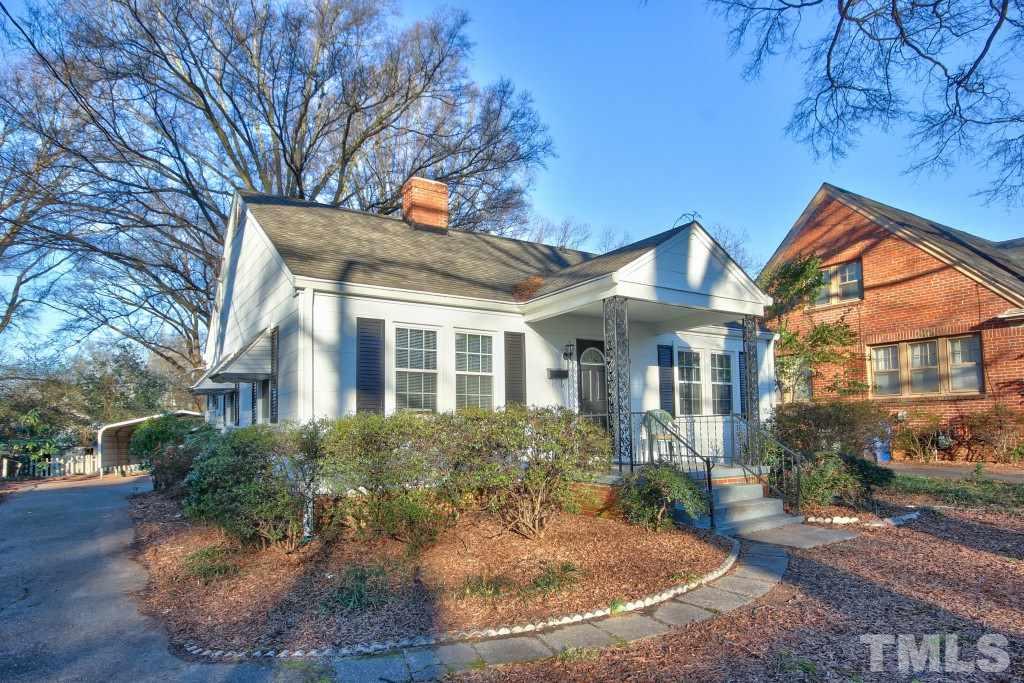 25 Bagwell Avenue Raleigh, NC 27607 - Photo 2 of 19 a view of a white house next to a yard with plants and trees