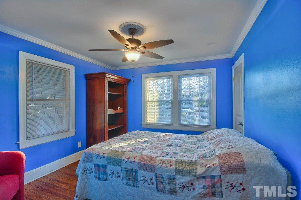 25 Bagwell Avenue Raleigh, NC 27607 - Photo 11 of 19 a bedroom with a large bed and a window