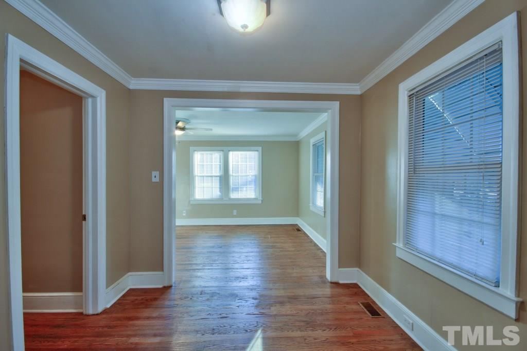 25 Bagwell Avenue Raleigh, NC 27607 - Photo 8 of 19 a view of hallway with wooden floor