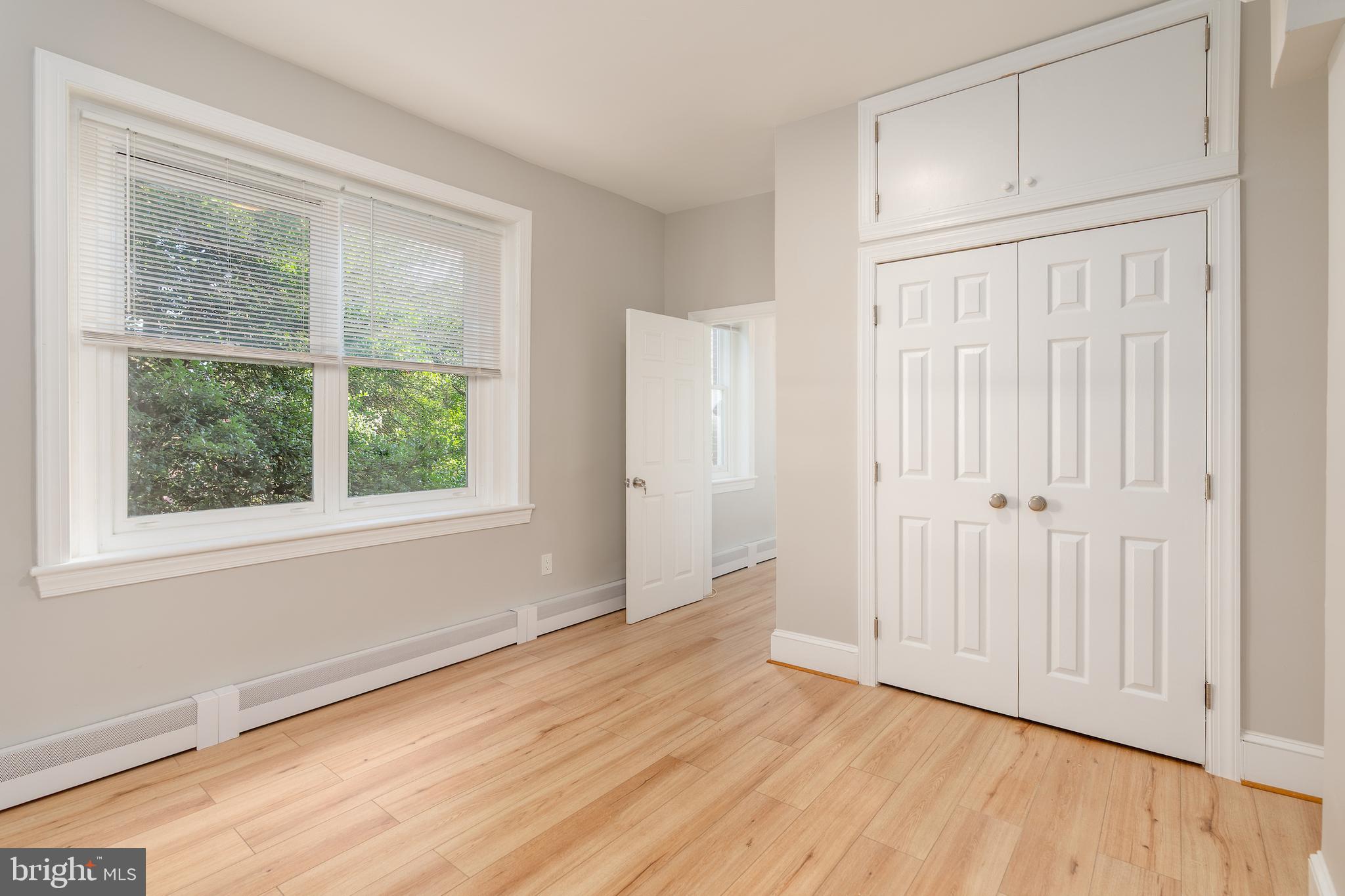 523 Constitution Avenue Northeast, Unit 3 Washington, DC 20002 - Photo 11 of 16 an empty room with wooden floor and windows