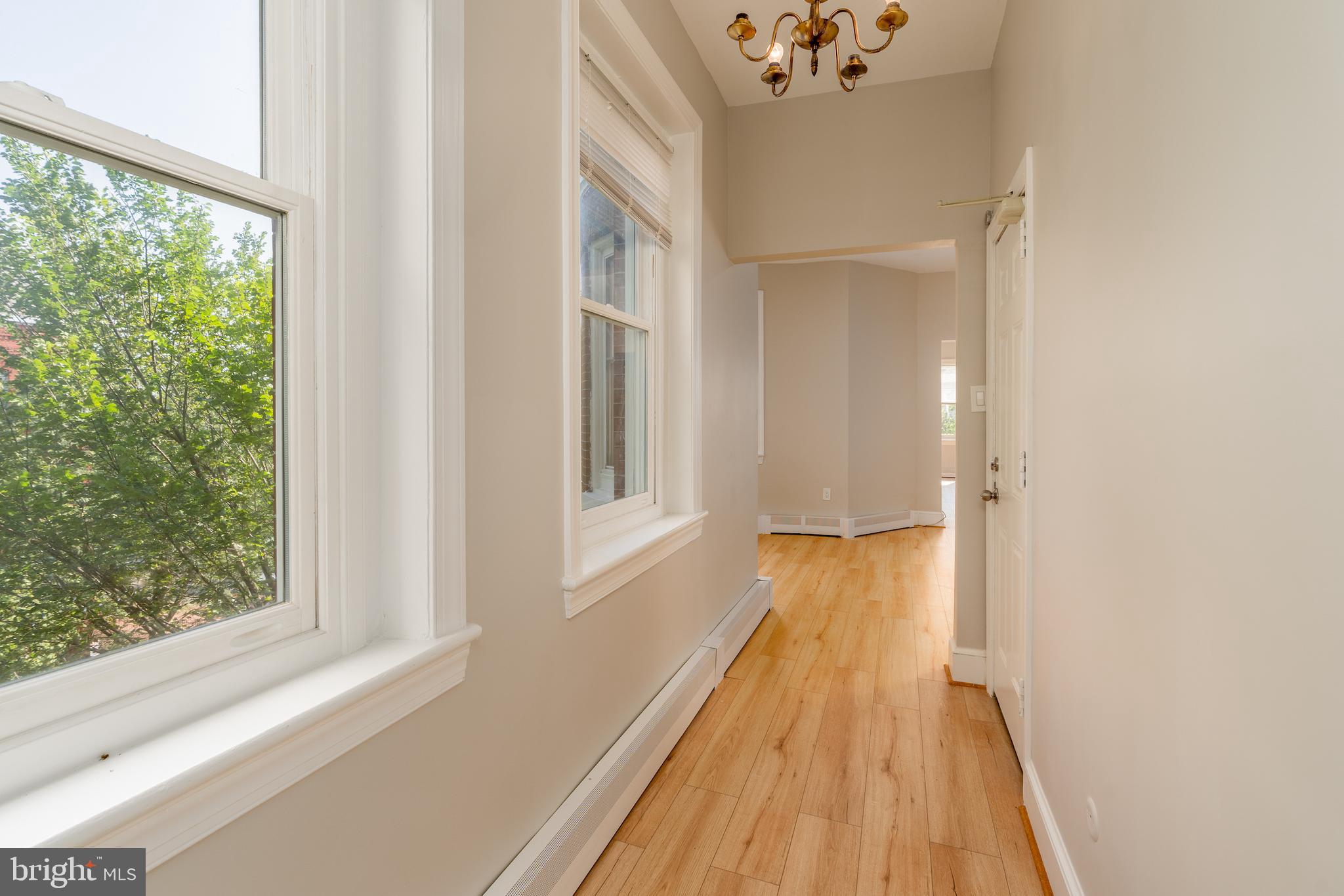 523 Constitution Avenue Northeast, Unit 3 Washington, DC 20002 - Photo 13 of 16 a view of a hallway with wooden floor and staircase