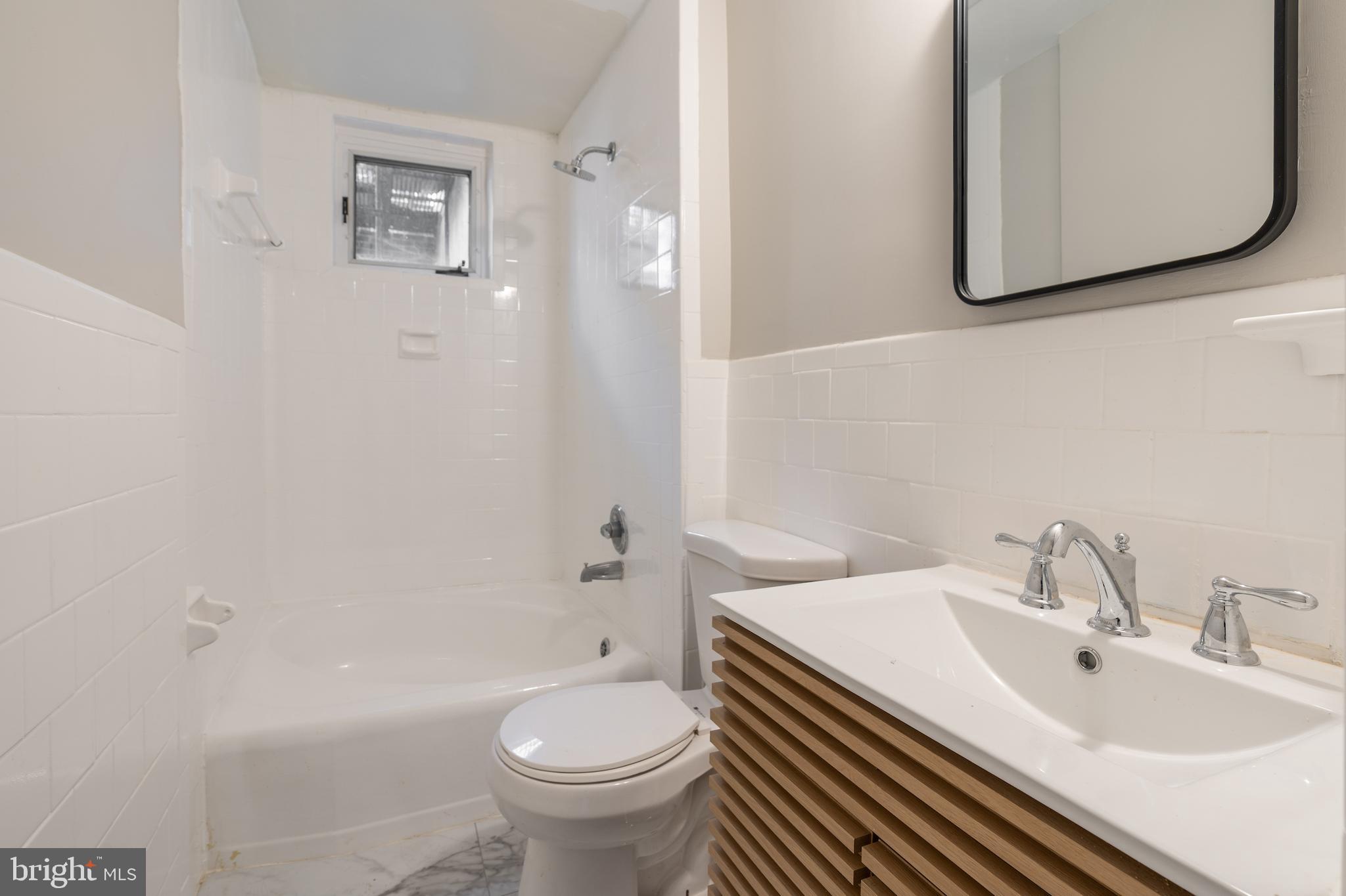 523 Constitution Avenue Northeast, Unit 3 Washington, DC 20002 - Photo 7 of 16 a bathroom with a sink and a mirror