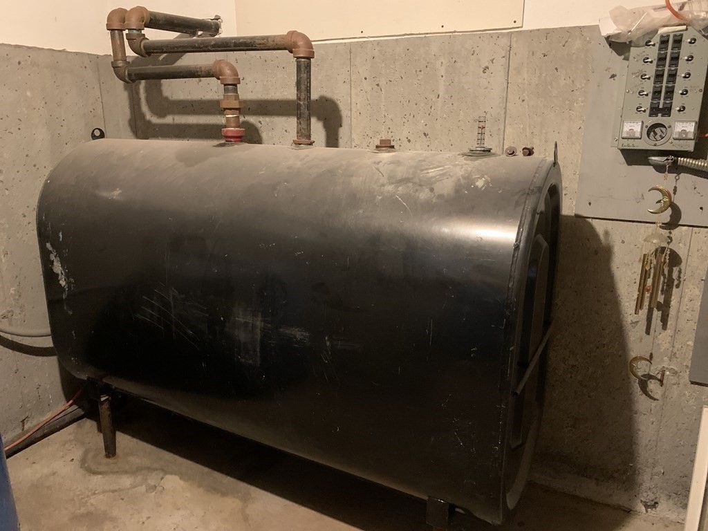 105 Sand Hill Road Shutesbury, MA 01072 - Photo 23 of 30 a bed with white sheets and pillows on it