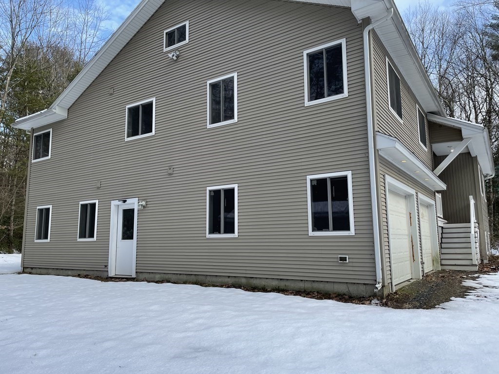 105 Sand Hill Road Shutesbury, MA 01072 - Photo 26 of 30 a house that has a window in front of it