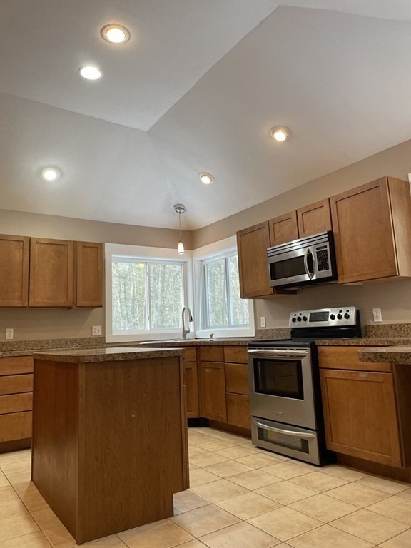 105 Sand Hill Road Shutesbury, MA 01072 - Photo 8 of 30 a kitchen with stainless steel appliances granite countertop a stove a sink and a microwave