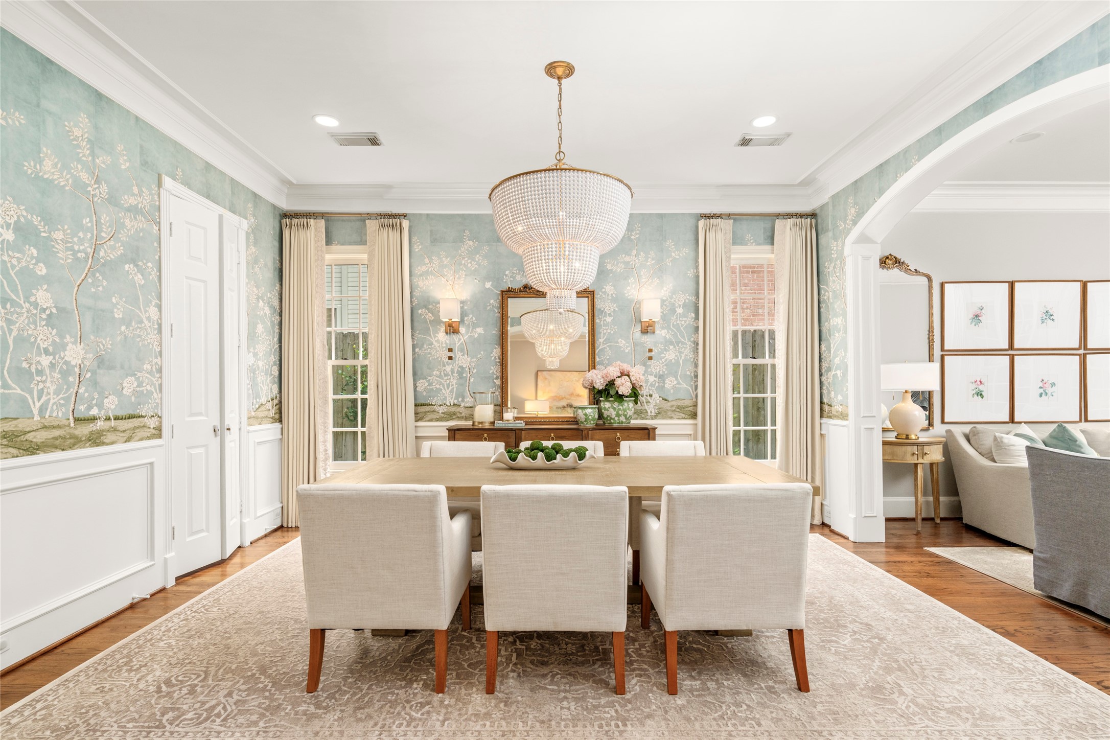 4220 Riley Street West University Place, TX 77005 - Photo 6 of 35 Step inside the light-filled dining room. This space is adorned by designer-inspired wallpaper, framed by floor-to-ceiling windows and an elegant archway to the stylish living room.