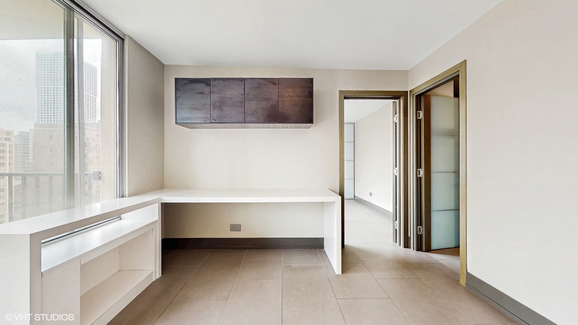 71 East Division Street, Unit 1801 Chicago, IL 60611 - Photo 15 of 31 a view of an empty room with a window