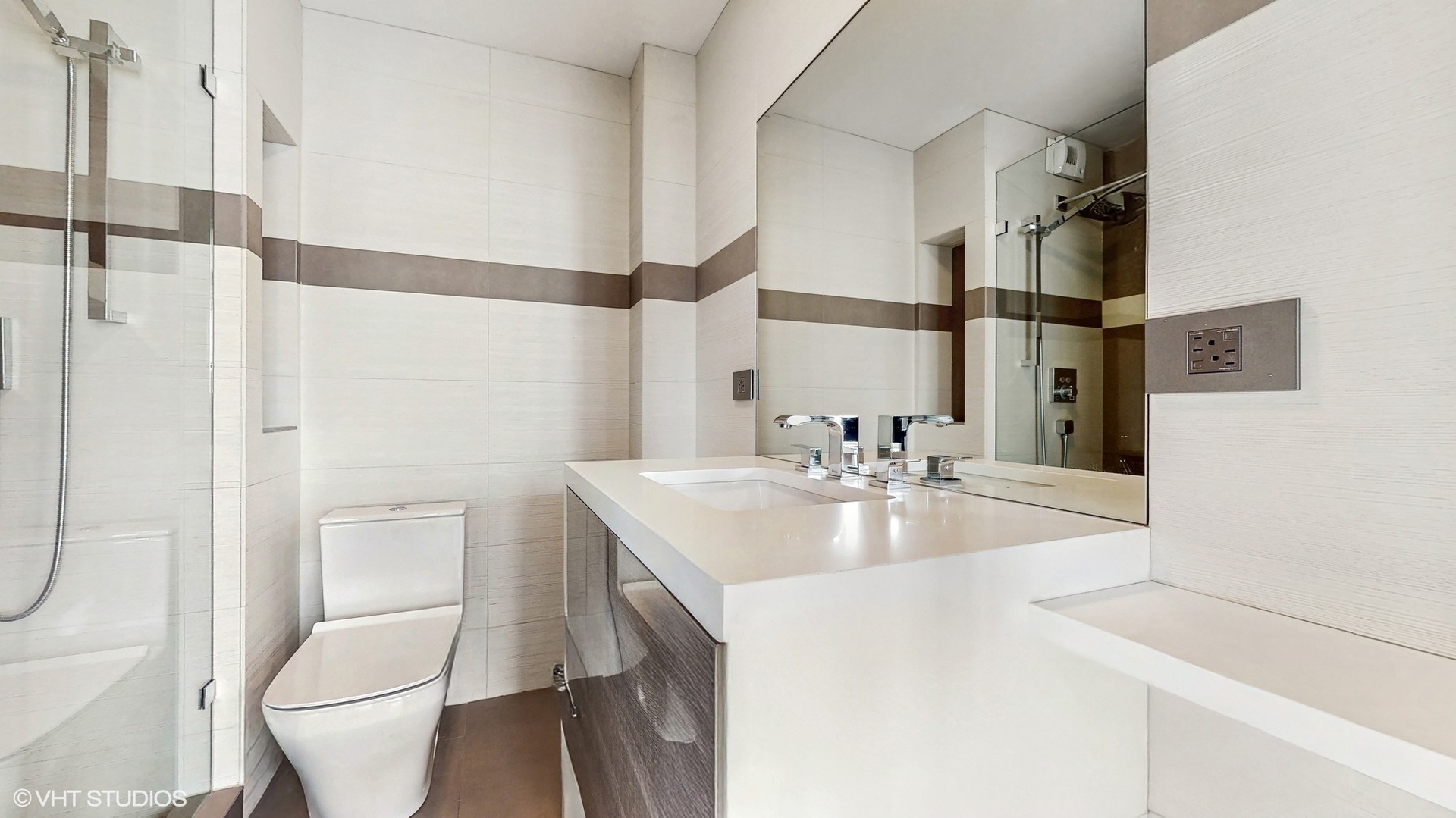 71 East Division Street, Unit 1801 Chicago, IL 60611 - Photo 16 of 31 a bathroom with a sink toilet and shower