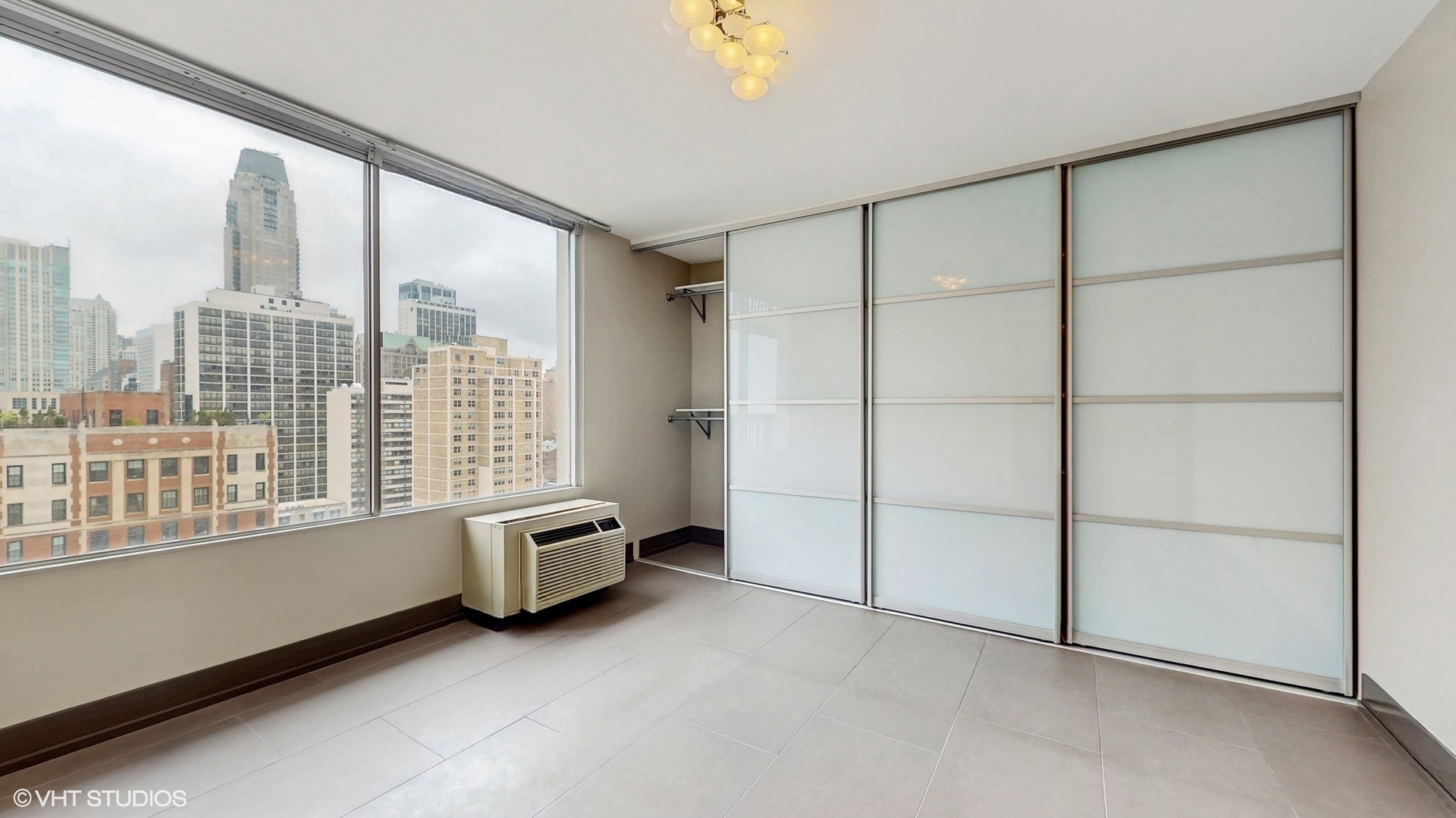 71 East Division Street, Unit 1801 Chicago, IL 60611 - Photo 17 of 31 an empty room with windows