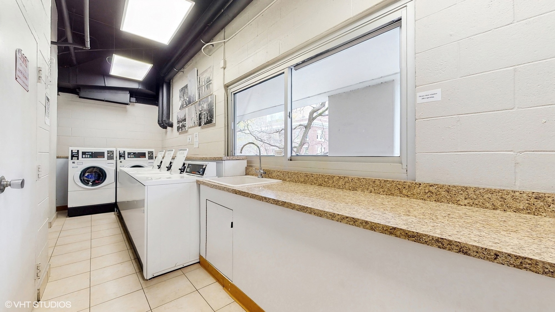 71 East Division Street, Unit 1801 Chicago, IL 60611 - Photo 21 of 31 a utility room with cabinets washer and dryer