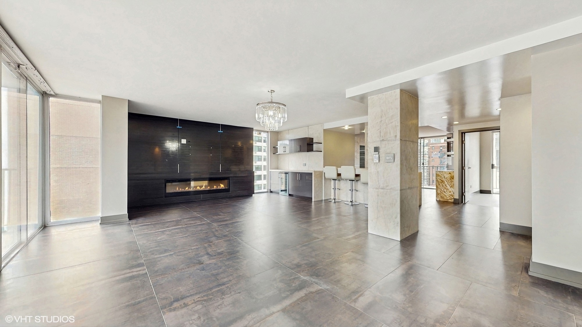 71 East Division Street, Unit 1801 Chicago, IL 60611 - Photo 3 of 31 a view of a livingroom with furniture wooden floor and windows