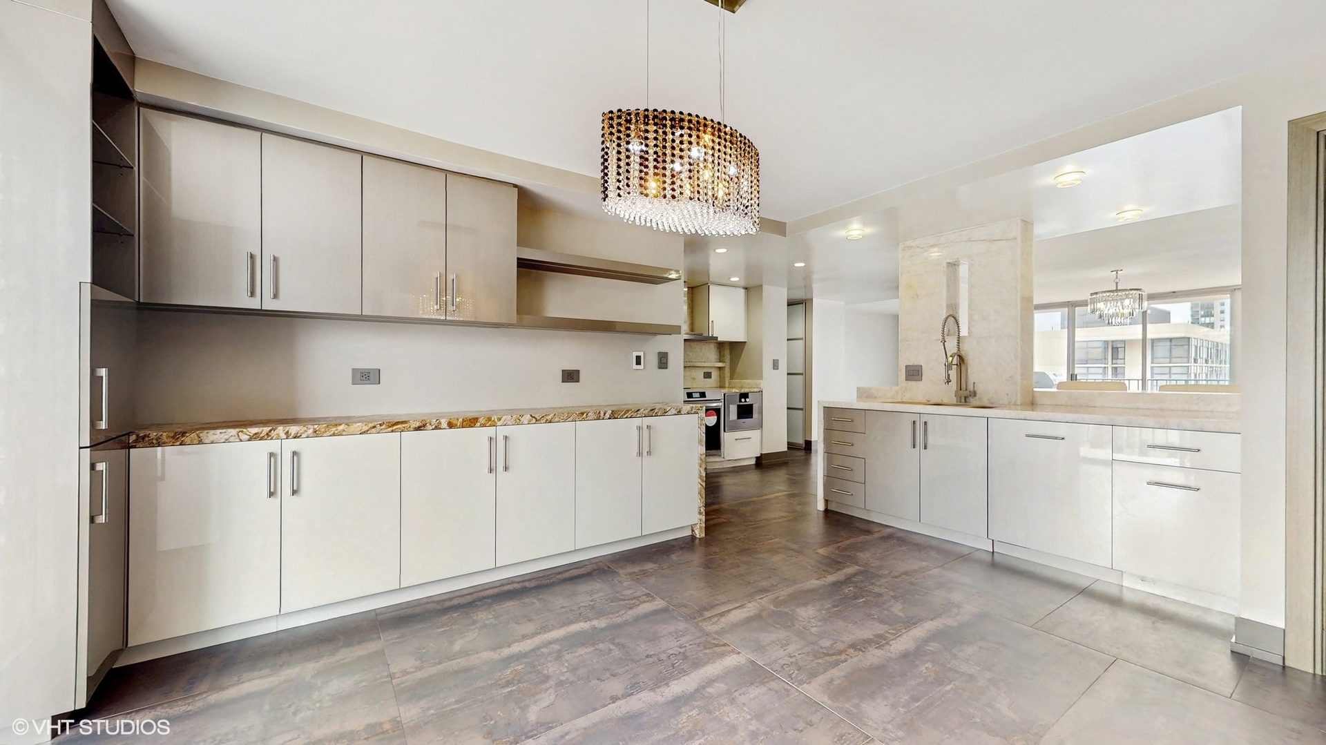 71 East Division Street, Unit 1801 Chicago, IL 60611 - Photo 6 of 31 a kitchen with granite countertop a white stove top oven sink and cabinets