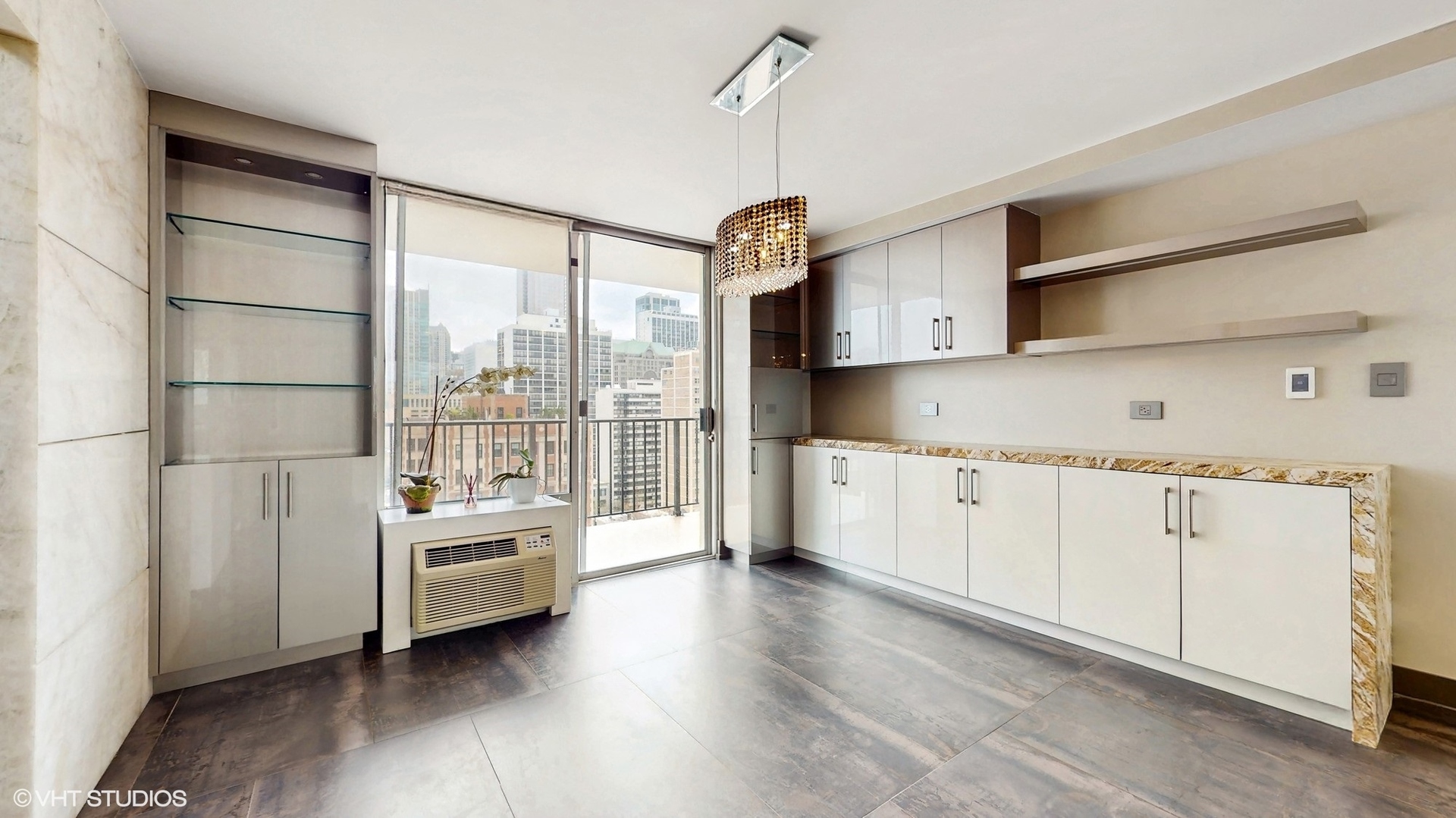 71 East Division Street, Unit 1801 Chicago, IL 60611 - Photo 7 of 31 a kitchen with stainless steel appliances a stove and white cabinets
