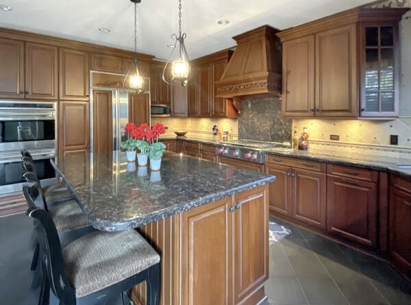 1408 Mink Trail Cary, IL 60013 - Photo 14 of 34 a kitchen with stainless steel appliances granite countertop a sink refrigerator and cabinets