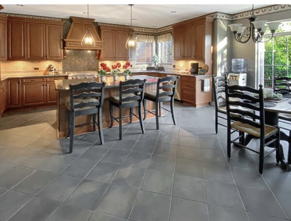 1408 Mink Trail Cary, IL 60013 - Photo 15 of 34 a kitchen with a table chairs and a stove