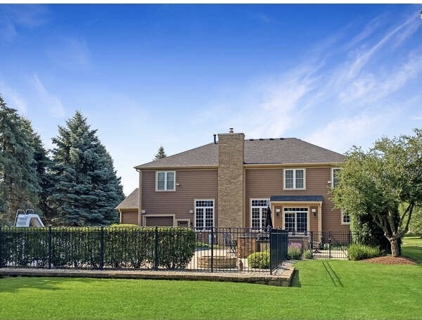 1408 Mink Trail Cary, IL 60013 - Photo 2 of 34 a front view of a house with a garden