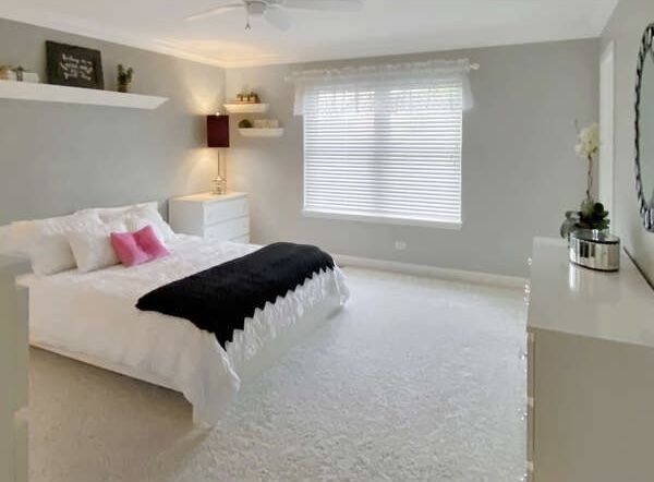 1408 Mink Trail Cary, IL 60013 - Photo 22 of 34 a bedroom with a bed and window