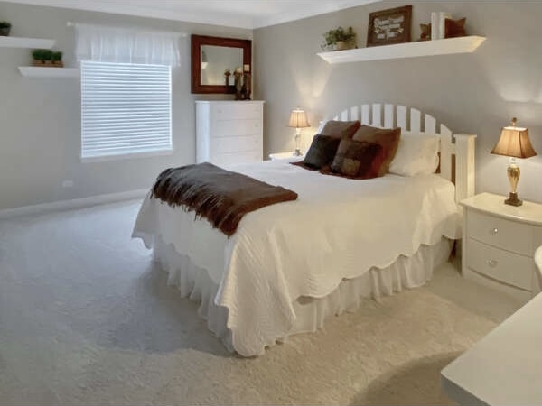 1408 Mink Trail Cary, IL 60013 - Photo 23 of 34 a bedroom with a bed and a night stand