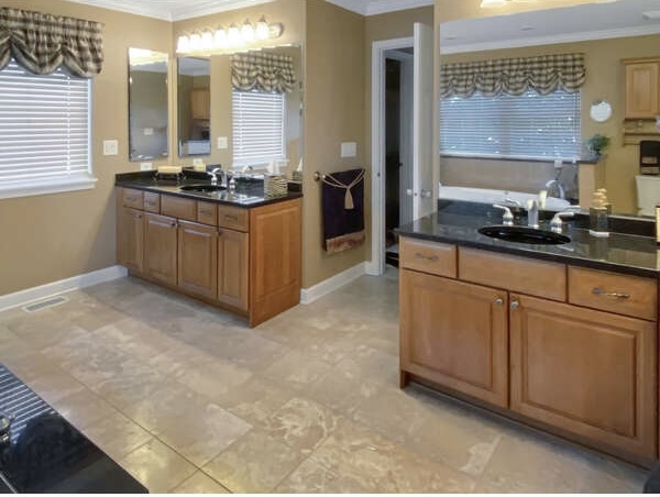 1408 Mink Trail Cary, IL 60013 - Photo 28 of 34 a kitchen with stainless steel appliances granite countertop a sink stove and cabinets