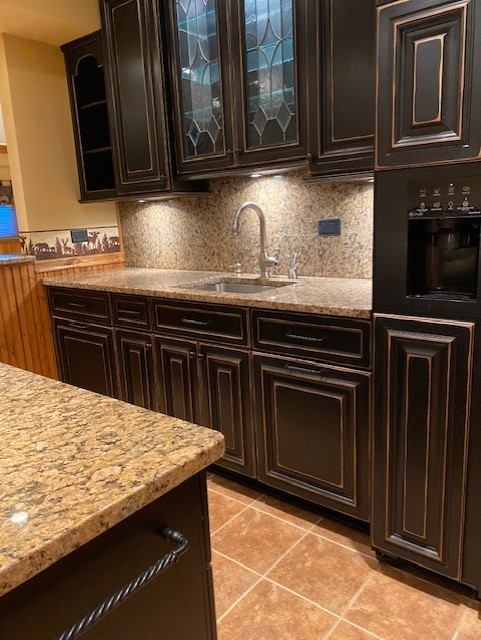 1408 Mink Trail Cary, IL 60013 - Photo 31 of 34 a kitchen with granite countertop a stove top oven
