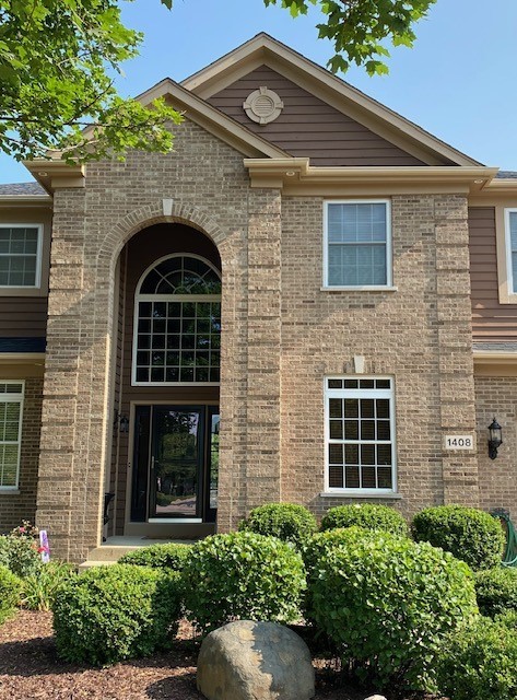 1408 Mink Trail Cary, IL 60013 - Photo 4 of 34 a front view of a house with a yard