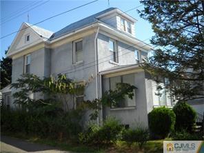 227 Washington Road Sayreville, NJ 08872 - Photo 1 of 16 a front view of a house with garden