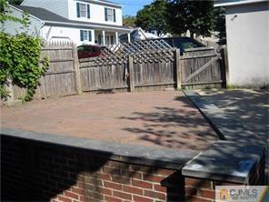 227 Washington Road Sayreville, NJ 08872 - Photo 3 of 16 a view of a house with a wooden fence