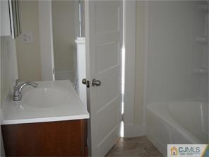 227 Washington Road Sayreville, NJ 08872 - Photo 9 of 16 a bathroom with a sink and a tub