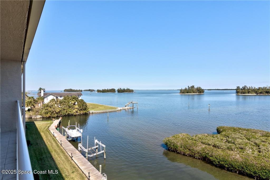 6061 North River Run Drive, Unit 6061 Sebastian, FL 32958 - Photo 11 of 36 wooden floor to ceiling windows and outdoor view