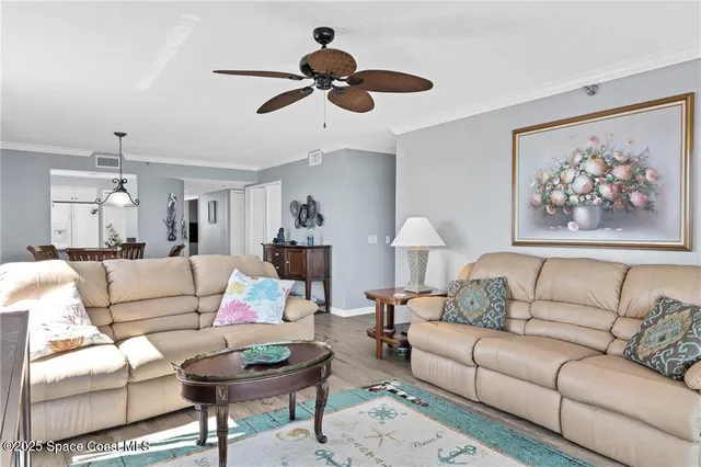 a living room with furniture and a painting