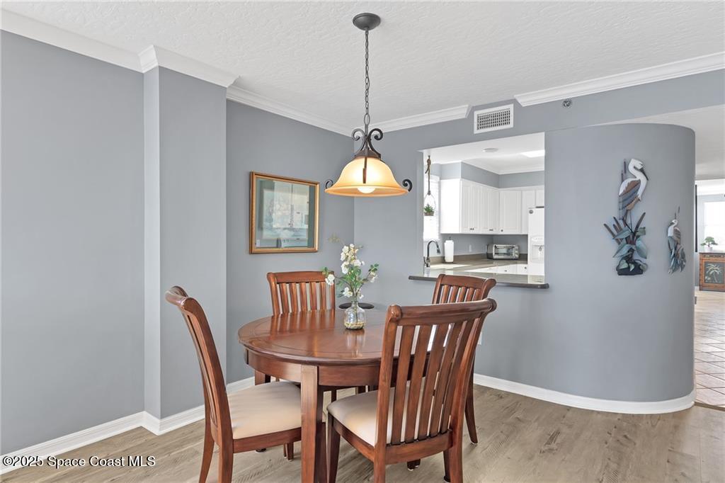 6061 North River Run Drive, Unit 6061 Sebastian, FL 32958 - Photo 16 of 36 a dining room with furniture and window