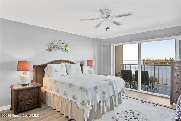 a bedroom with a bed a couch and a window