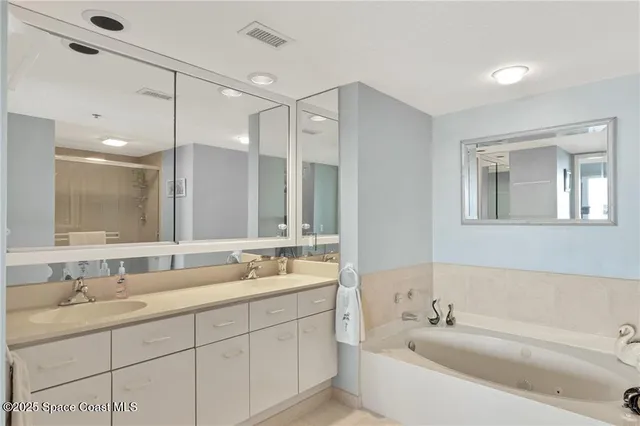 a bathroom with a double vanity sink mirror and double