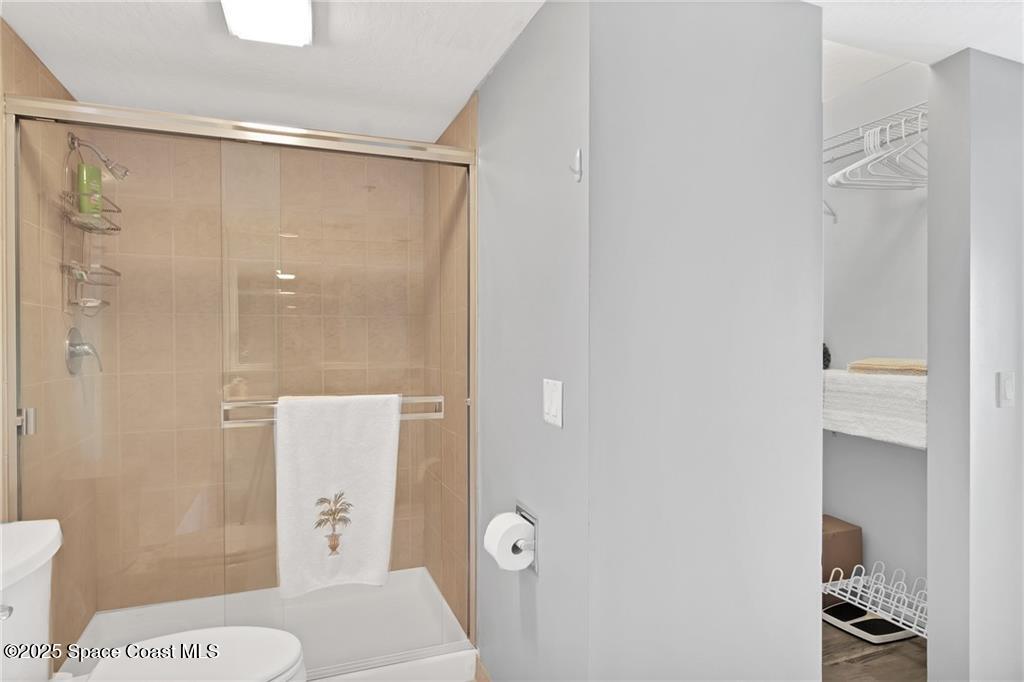 6061 North River Run Drive, Unit 6061 Sebastian, FL 32958 - Photo 24 of 36 a bathroom with a shower and toilet