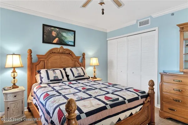 a bedroom with a bed and lamp