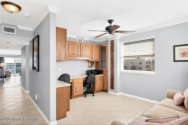 a view of a livingroom with furniture and windows