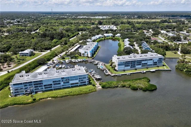 a view of a house with a yard and a mountain view
