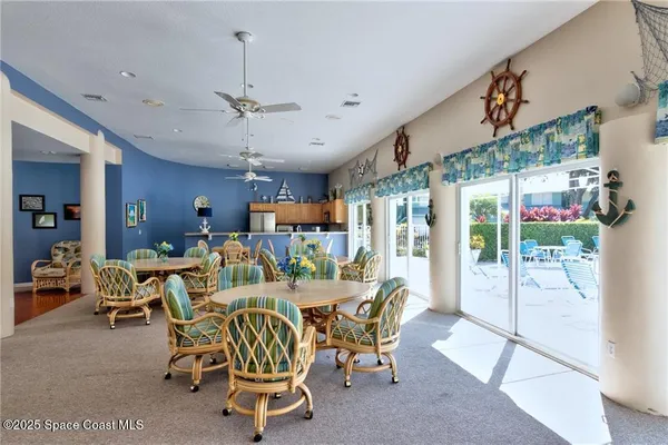 a view of a dining room with furniture window and outside view