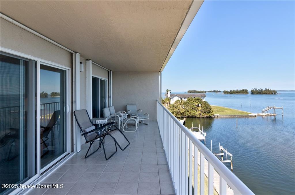 6061 North River Run Drive, Unit 6061 Sebastian, FL 32958 - Photo 9 of 36 a balcony with an outdoor seating