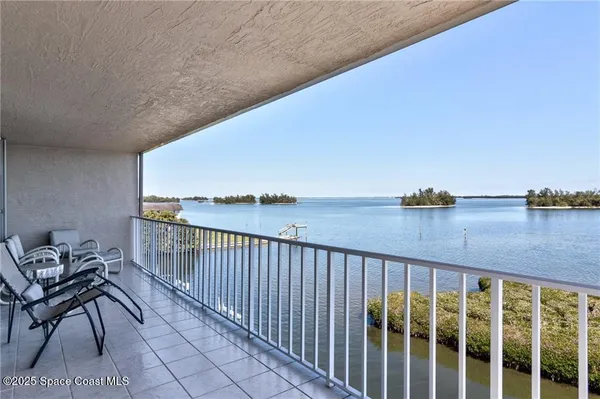 a view of balcony with furniture