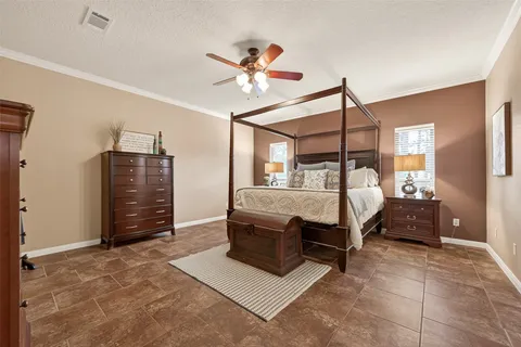 a bedroom with a bed and a dresser
