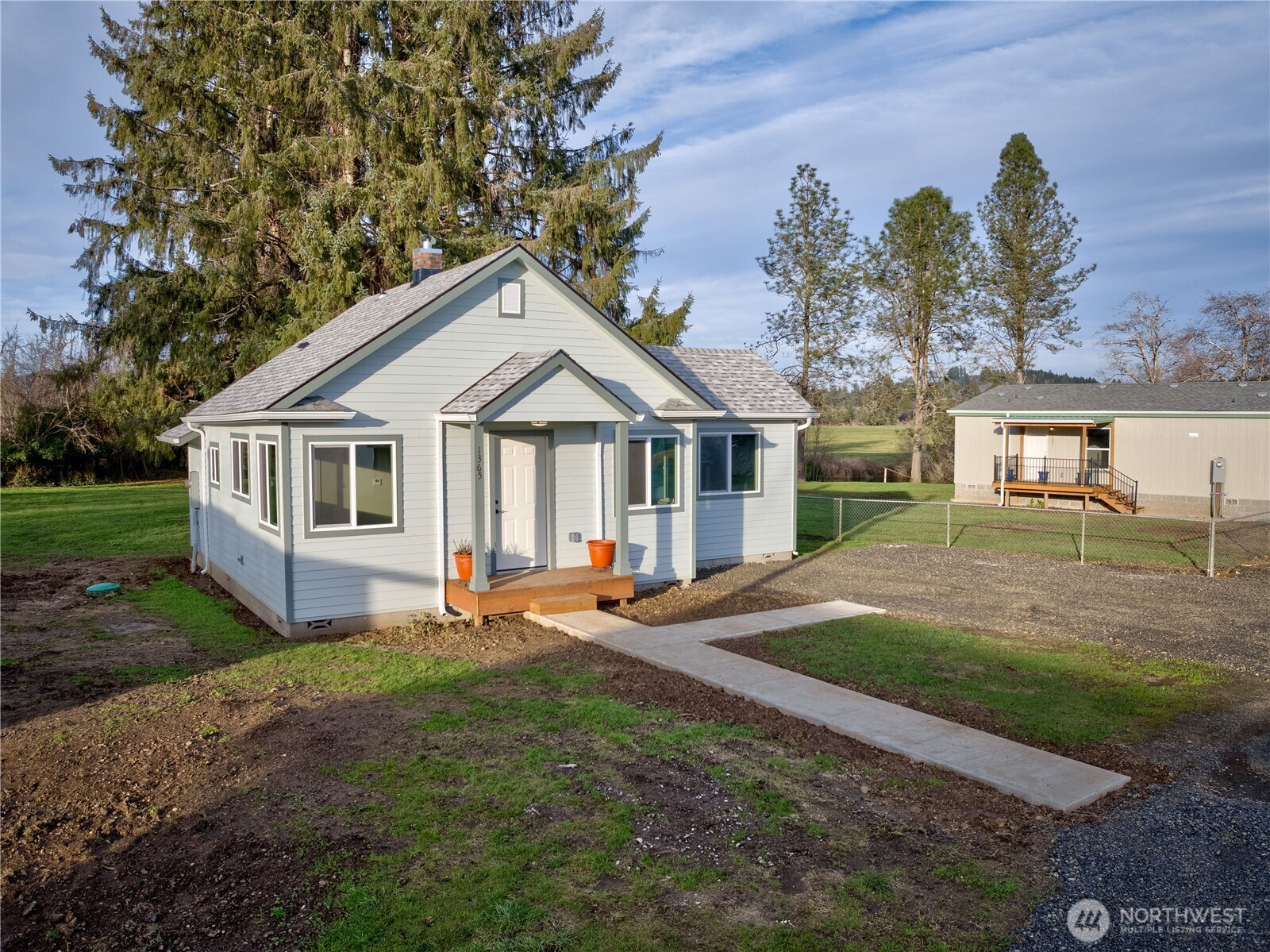 1365 Dolan Street Raymond, WA 98577 - Photo 3 of 24 a view of a house with backyard sitting area and garden
