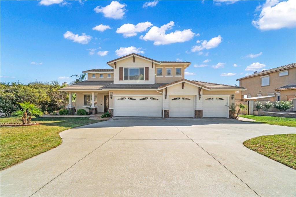 12741 Ridgecrest Drive Rancho Cucamonga, CA 91739 - Photo 1 of 1 a front view of a house with a yard and garage